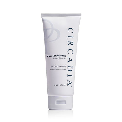 Circadia Micro-Exfoliating Honey Cleanser in a clear bottle with a pump dispenser, showing the light golden liquid inside.
