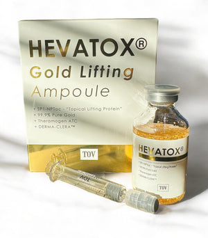 TOV Hevatox Gold Lifting Ampoule in a clear vial showcasing its golden serum and sleek packaging design.