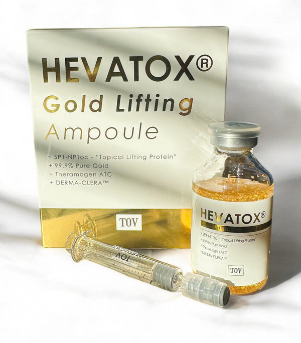 TOV Hevatox Gold Lifting Ampoule in a clear vial showcasing its golden serum and sleek packaging design.