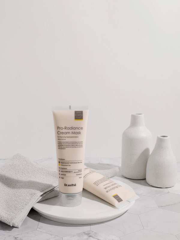 Dr. Esthe Pro-Radiance Cream Mask in a jar with a smooth, creamy texture shown on a clean background.