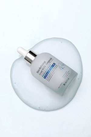 Dr. Esthe Skin Refining Goat Milk Ampoule 50 ml in a dropper bottle showcasing its creamy texture for facial care.
