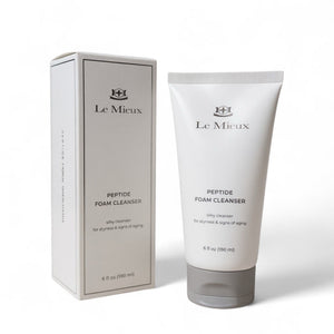 Le Mieux Anti-Aging Facial Wash Peptide Foam Cleanser in a 6oz bottle with a foamy texture displayed on a clean surface.