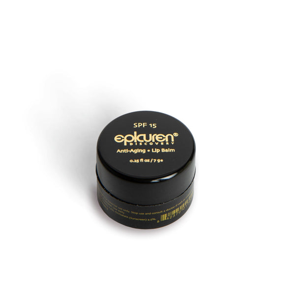 Epicuren Discovery Anti-Aging Lip Balm SPF 15 in a black pot, showcasing its smooth texture and protective formula.