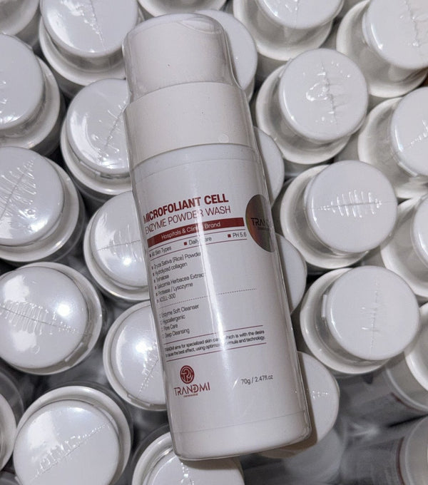 Tov Beauty Trandmi Microfoliant Cell Enzyme Powder Wash in a white container with a scoop, set against a light background.