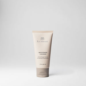 Le Mieux Brightening Cleanser in a 2oz tube, featuring a white and silver design with clear labeling, for gentle skin brightening.