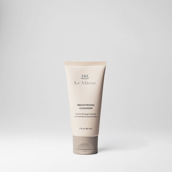 Le Mieux Brightening Cleanser in a 2oz tube, featuring a white and silver design with clear labeling, for gentle skin brightening.