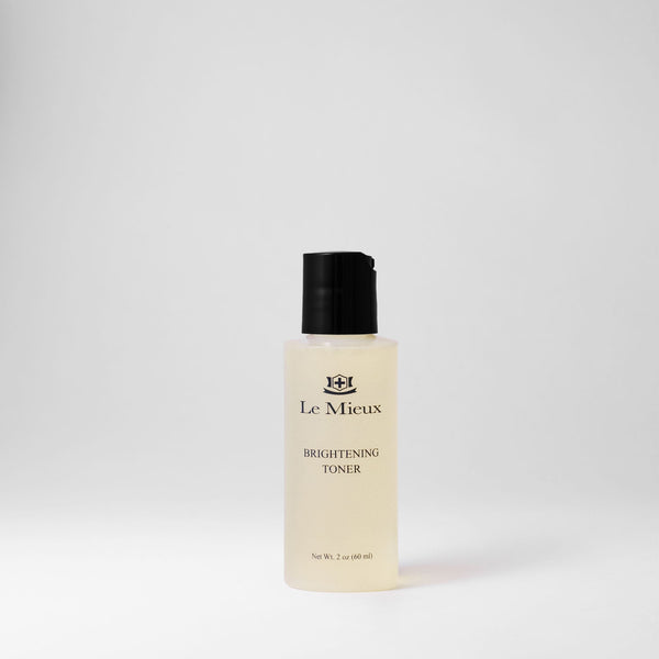 Le Mieux Brightening Toner in a 2oz bottle, clear liquid with a clean label, designed to brighten and refresh the skin.