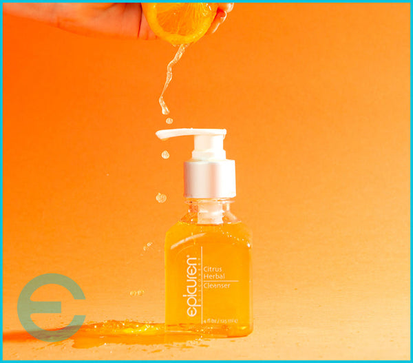 Epicuren Discovery Citrus Herbal Cleanser in a lifestyle setting, showcasing its vibrant packaging and herbal ingredients.