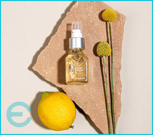 Epicuren Discovery Citrus Herbal Cleanser in a bottle with citrus fruits, showcasing a refreshing skincare routine.