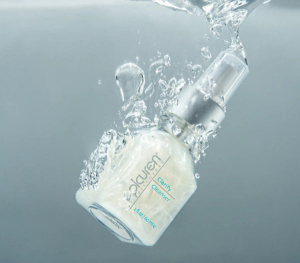 Epicuren Discovery Clarify Cleanser in a lifestyle setting, showcasing its sleek packaging and texture.