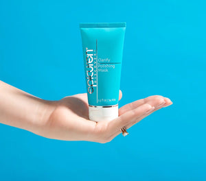 Epicuren Discovery Clarify Polishing Mask in a small jar, showcasing its creamy texture for exfoliating skin.