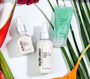 Epicuren Discovery Coconut Hydrating Milk bottle surrounded by coconuts and tropical leaves in a serene setting.