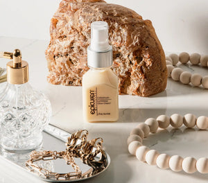 Epicuren Discovery Colostrum Luminous Glow Cream in a jar, showcasing its creamy texture and luminous glow in a lifestyle setting.