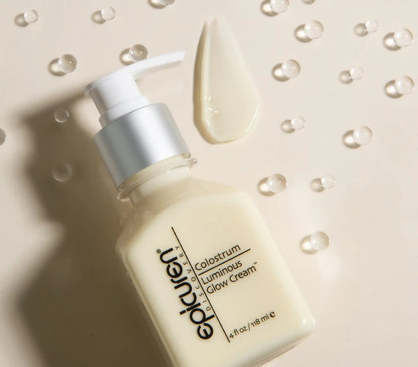 Epicuren Discovery Colostrum Luminous Glow Cream in a jar on a soft surface, showcasing its rich texture and luminous glow.