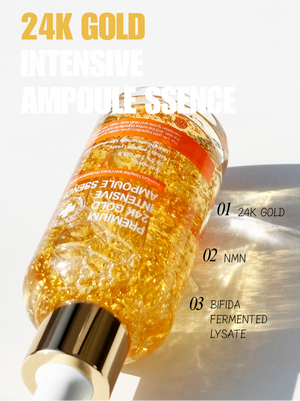 Tov Beauty Trandmi 24k Gold Intensive Ampoule-ssence bottle with a gold liquid for hydration on a neutral background.