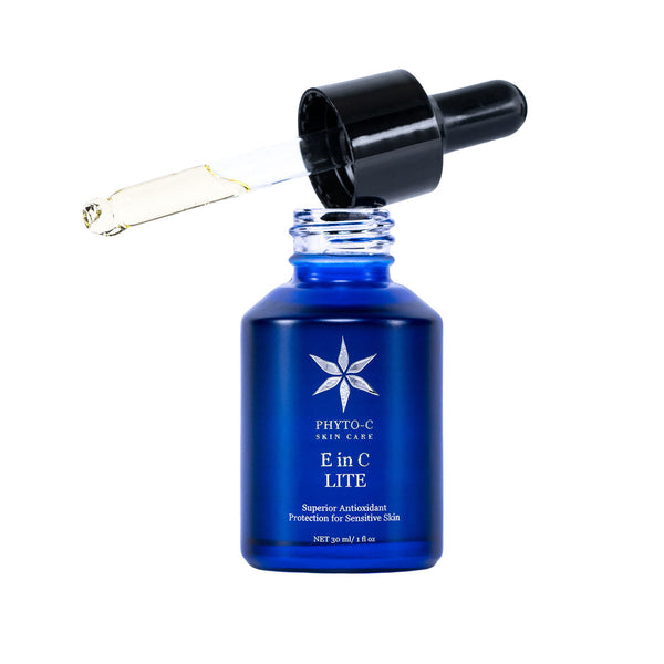 Phyto-C Skin Care E in C Lite serum in a sleek bottle with a dropper, showcasing a clear, lightweight formula.
