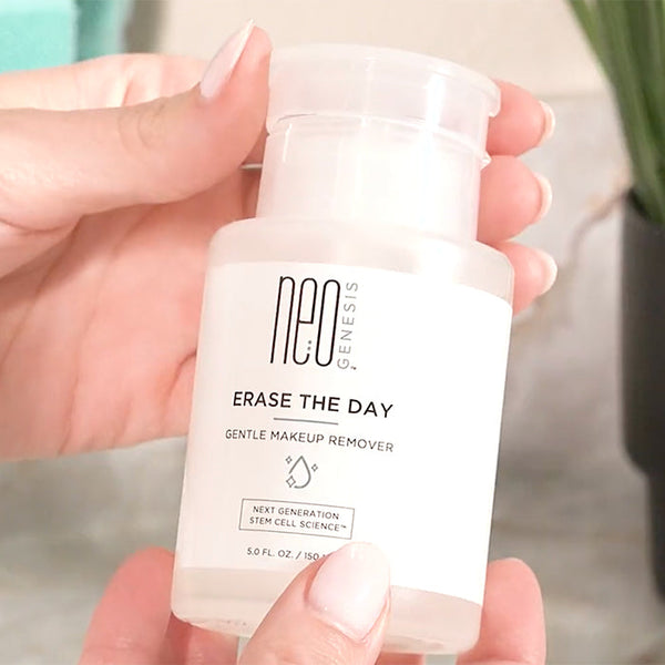 NeoGenesis Erase The Day Gentle Makeup Remover in a clean, serene bathroom setting with soft lighting.