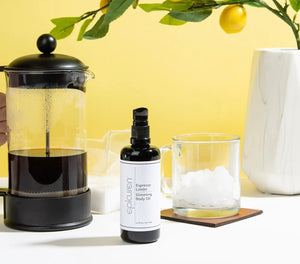 Epicuren Discovery Espresso Limón Slimming Oil moisturizer in a sleek bottle with a lemon and coffee bean background.