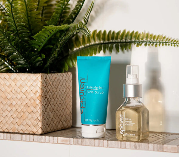 Epicuren Discovery Fine Herbal Facial Scrub displayed in a serene, natural setting with fresh herbs and texture visible.