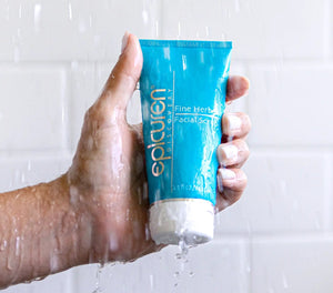 Epicuren Discovery Fine Herbal Facial Scrub in a serene setting, showcasing the product's texture and natural ingredients.