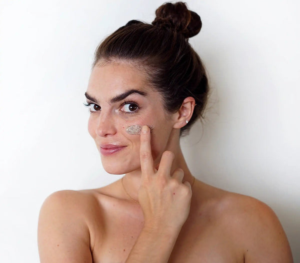 Fine Herbal Facial Scrub by Epicuren Discovery in a lifestyle setting, showcasing its texture and natural ingredients.