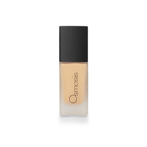 Osmosis Beauty Flawless Foundation in Honey shade, showcasing a sleek bottle with a pump and elegant design.