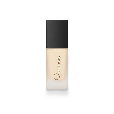 Osmosis Flawless Foundation in Ivory, showcasing smooth texture and creamy consistency in a sleek bottle.
