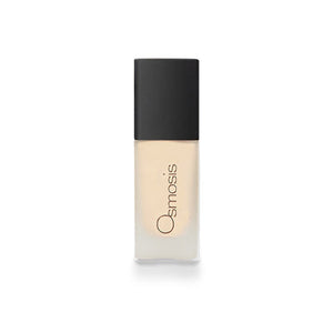 Osmosis Beauty Flawless Foundation in Sand shade, showcasing a smooth, creamy texture in a sleek container.