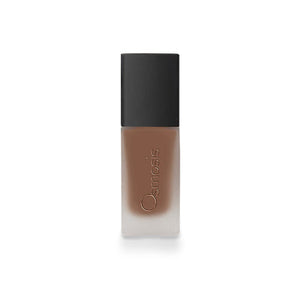 Osmosis Beauty Flawless Foundation in Truffle shade, showcasing a bottle with a pump and smooth, creamy texture.