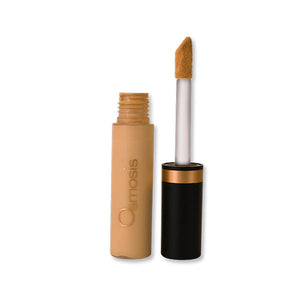 Osmosis Beauty Flawless Concealer in Dusk, showcasing the sleek applicator and creamy texture for even coverage.