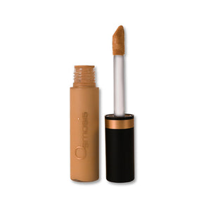 Osmosis Beauty Flawless Concealer in Honey shade, showcasing the sleek applicator and creamy texture in the container.