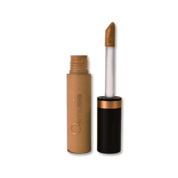 Osmosis Beauty Flawless Concealer in Wheat, showcasing the sleek applicator and creamy texture in a compact design.