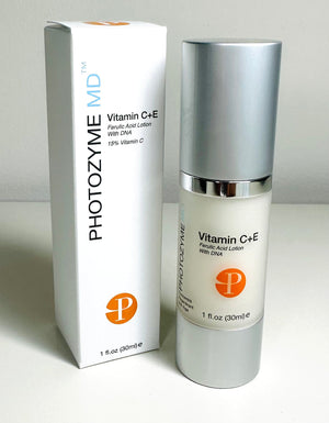 Photozyme Vitamin C+E + Ferulic Acid Lotion in a clear bottle, showcasing a lightweight facial serum texture.