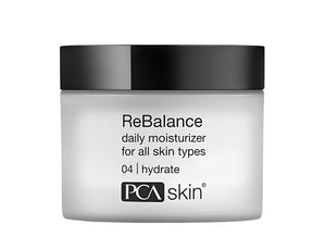 A white jar of PCA Skin ReBalance Daily Moisturizer for all skin types with a 1.7 oz label.