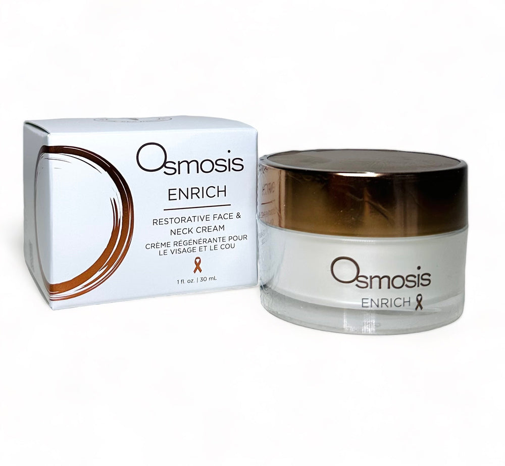 Osmosis Beauty Enrich Restorative Face and Neck Cream jar on a wooden surface with soft lighting.