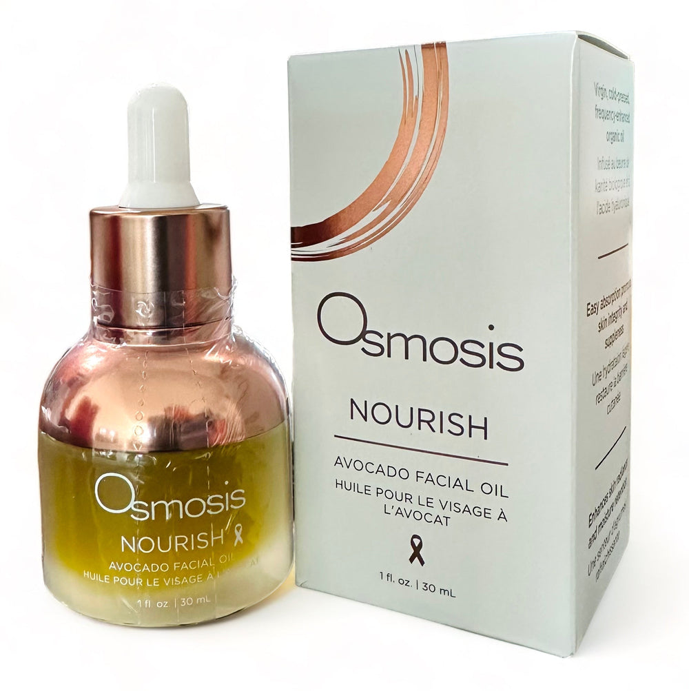 Osmosis Nourish Avocado Facial Oil bottle with green cap on a wooden surface, showcasing its natural moisturizing properties.