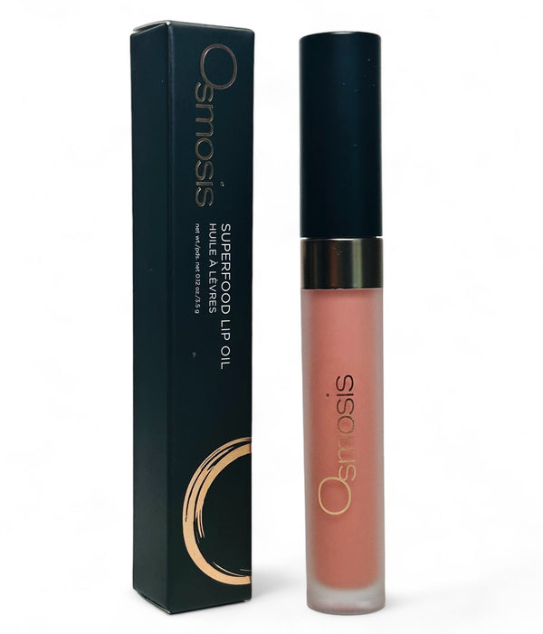 Osmosis Beauty Superfood Lip Oil in a clear tube, showcasing a smooth applicator and vibrant oil color.