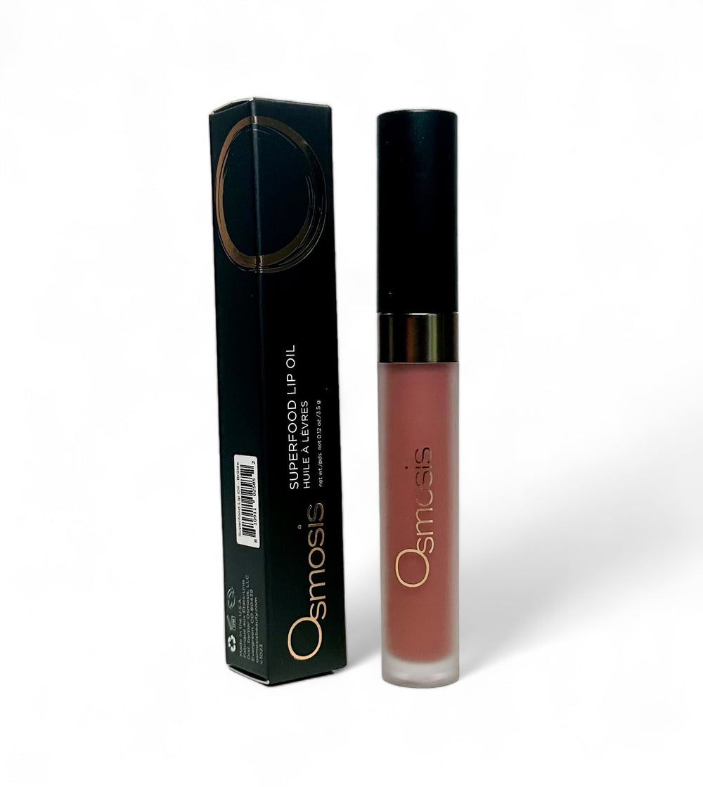 Osmosis Beauty Superfood Lip Oil in a sleek applicator, showcasing its nourishing formula and vibrant color.