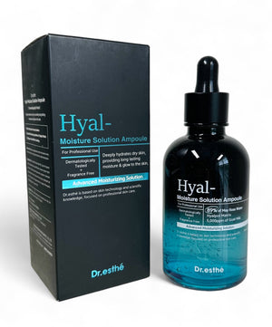 Dr. Esthe Hyal Moisture Solution Ampoule 150ml with a roller face massager on a clean surface.