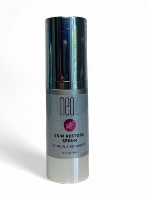 NeoGenesis Skin Restore Serum in a clear bottle with a dropper, showcasing its lightweight texture and elegant design.