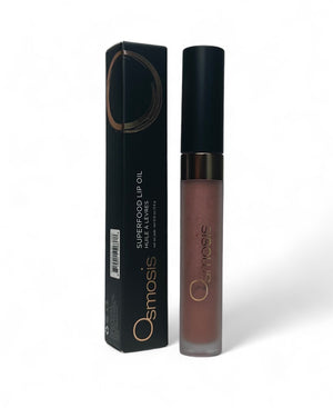 Osmosis Beauty Superfood Lip Oil in a sleek bottle with a glossy finish, highlighting its nourishing formula.