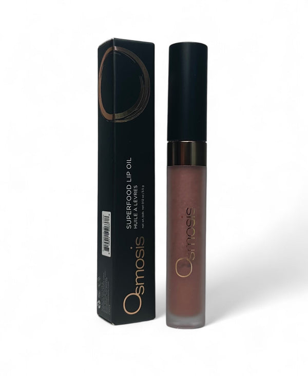 Osmosis Beauty Superfood Lip Oil in a sleek bottle with a glossy finish, highlighting its nourishing formula.