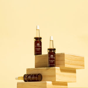 Le Mieux StemCell EGF serum bottle with dropper, featuring sleek packaging and product label, on a white background.