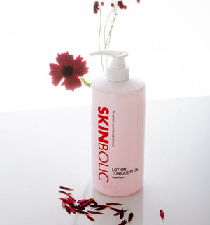 Skinbolic Lotion Tonique Rose cream in a sleek bottle with a pink label, showcasing its floral essence.