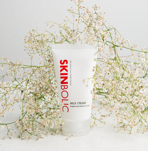 Skinbolic Milk Cream 150 ml in a white jar, showcasing a smooth cream texture and sleek branding design.