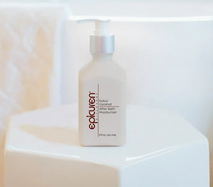 Epicuren Discovery Kukui Coconut After Bath Body Moisturizer in a stylish bottle with a tropical background.