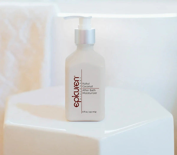 Epicuren Discovery Kukui Coconut After Bath Body Moisturizer in a stylish bottle with a tropical background.