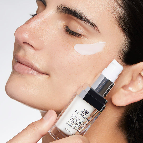 Le Mieux Eye Wrinkle Corrector Cream with hyaluronic acid and peptides in a white jar on a soft background.