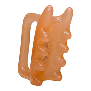 Light pink Halylo fascia facial and body massage tool, featuring G-type design for effective massage therapy.