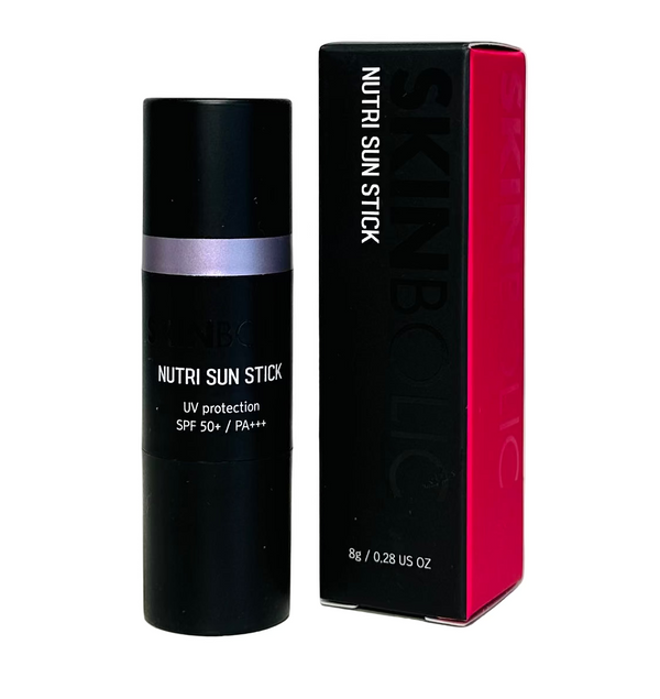 A sun stick with SPF 50+/PA+++ protection, the product is in a black tube with a pink label, next to its pink box.